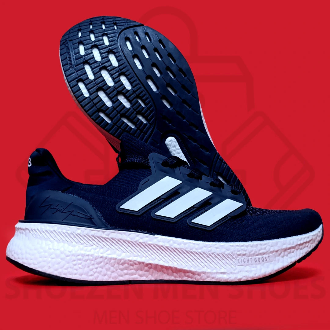 ADI LIGHT BOOST JOGGERS - SHOEZEN MEN SHOES - Navy blue running shoe with white sole on a red background