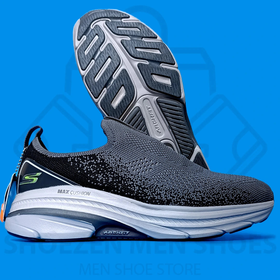ARCHFIT MAX CUSHION SKECHERS - SHOEZEN MEN SHOES - Black and gray athletic shoe with visible brand logo on a blue background