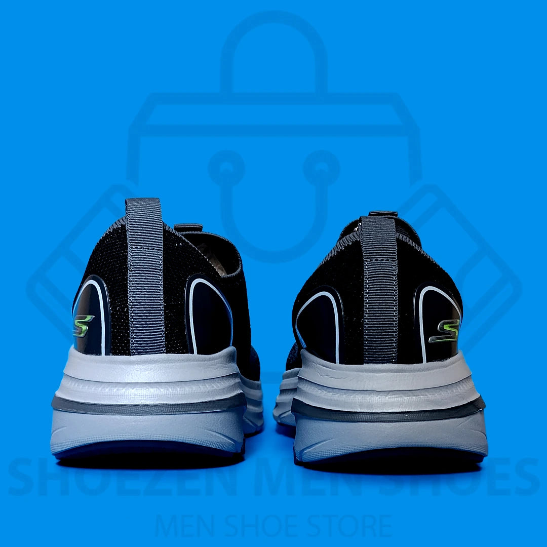 ARCHFIT MAX CUSHION SKECHERS - SHOEZEN MEN SHOES - Black and gray athletic shoe with visible brand logo on a blue background