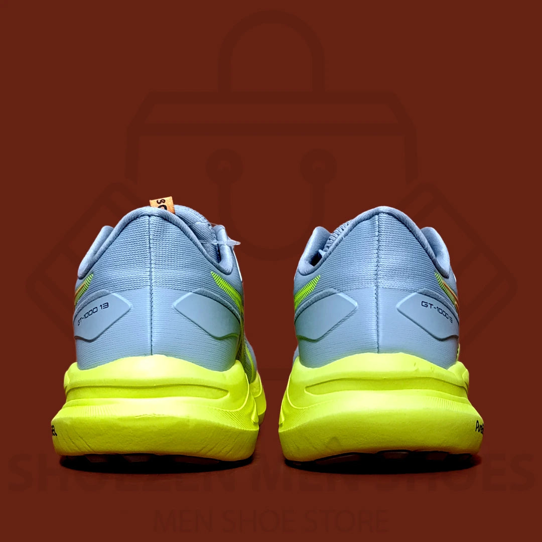 ASICS GEL "GT-1000" JOGGERS - SHOEZEN MEN SHOES - Blue and yellow running shoe with 'PureGEL' branding on a brown background