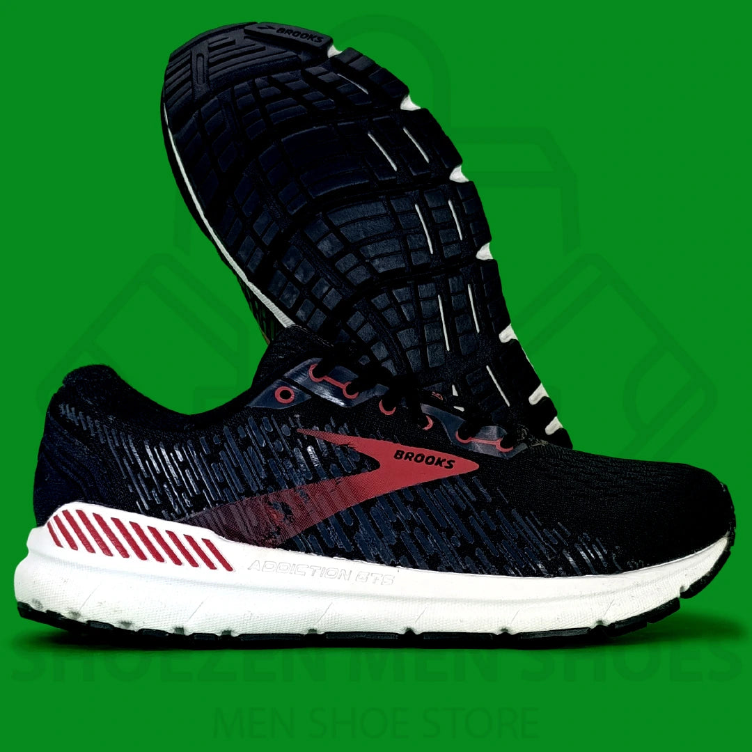Brooks Addiction GTS 15 Joggers - Shoezen Men Shoes - Black running shoe with red accents on a green background