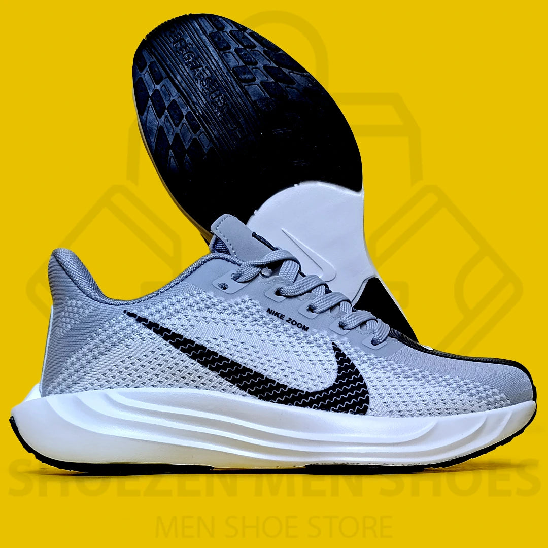 NK PEGASUS TURBO JOGGERS - SHOEZEN MEN SHOES - Gray running shoe with black Nike logo on a yellow background