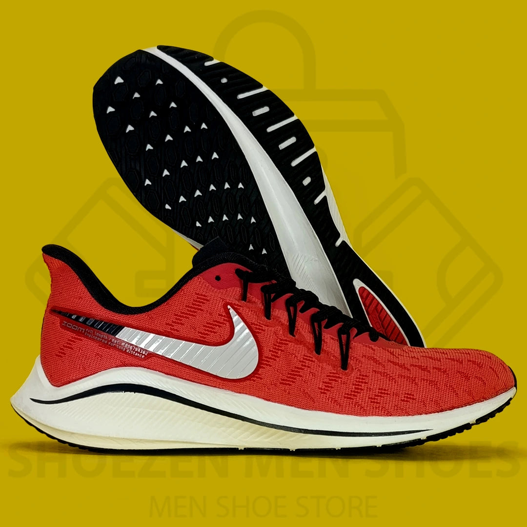 Nike Air Zoom Vomero 14 Joggers - Shoezen Men Shoes - Red and black running shoe with a white swoosh logo on a yellow background