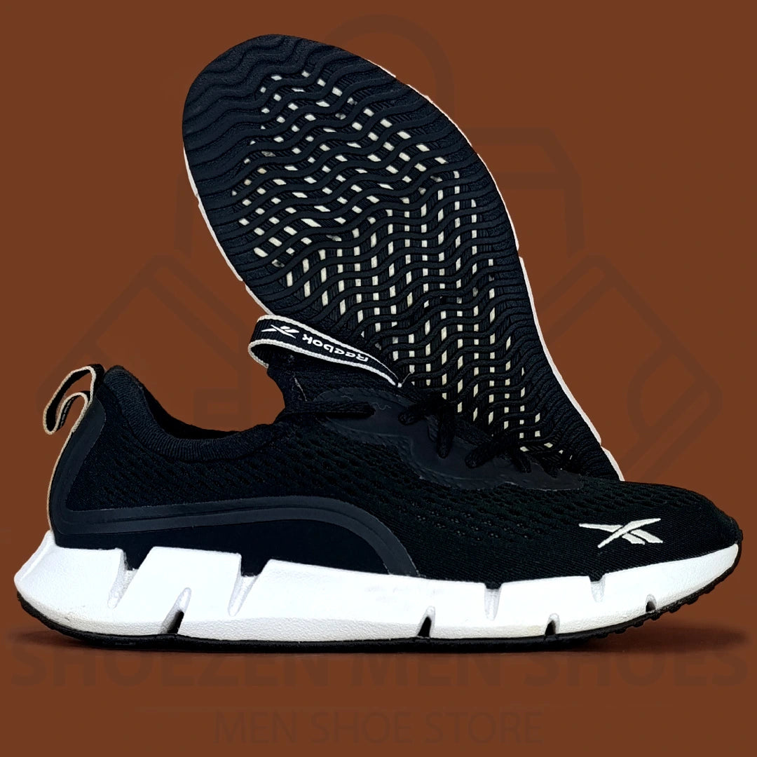 Rebk Zig Sky Training Shoes - Shoezen Men Shoes - Black running shoe with white sole on a brown background