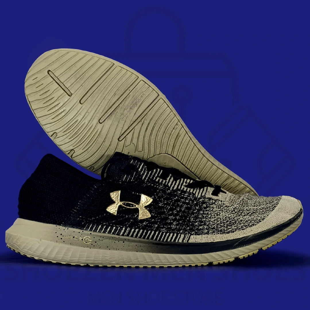 UA Threadborne Blur Running Shoes - Shoezen Men Shoes - Black athletic shoe with beige sole on a blue background