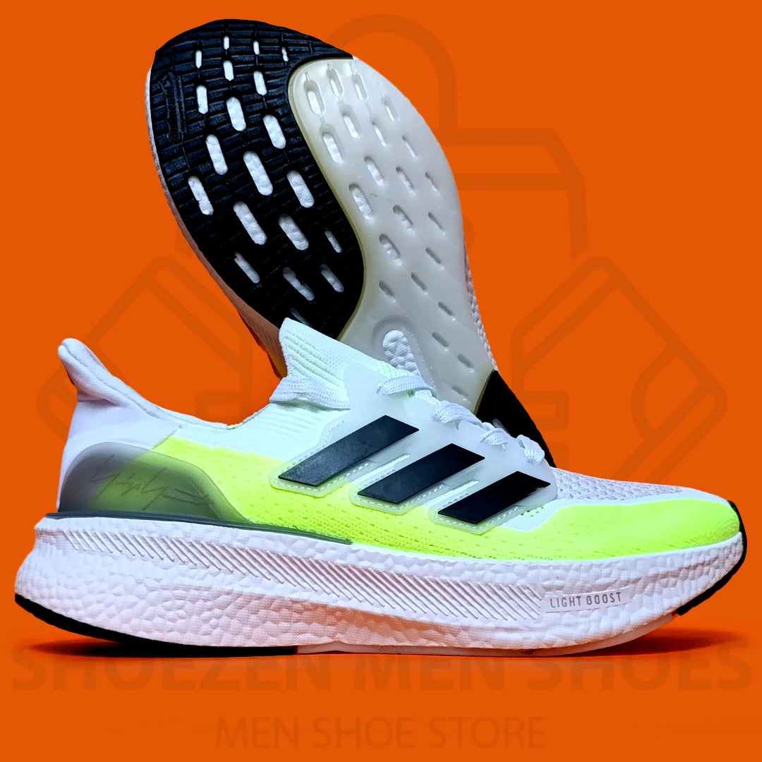 ADI LIGHT BOOST JOGGERS - SHOEZEN MEN SHOES - White and green running shoe with black accents on an orange background