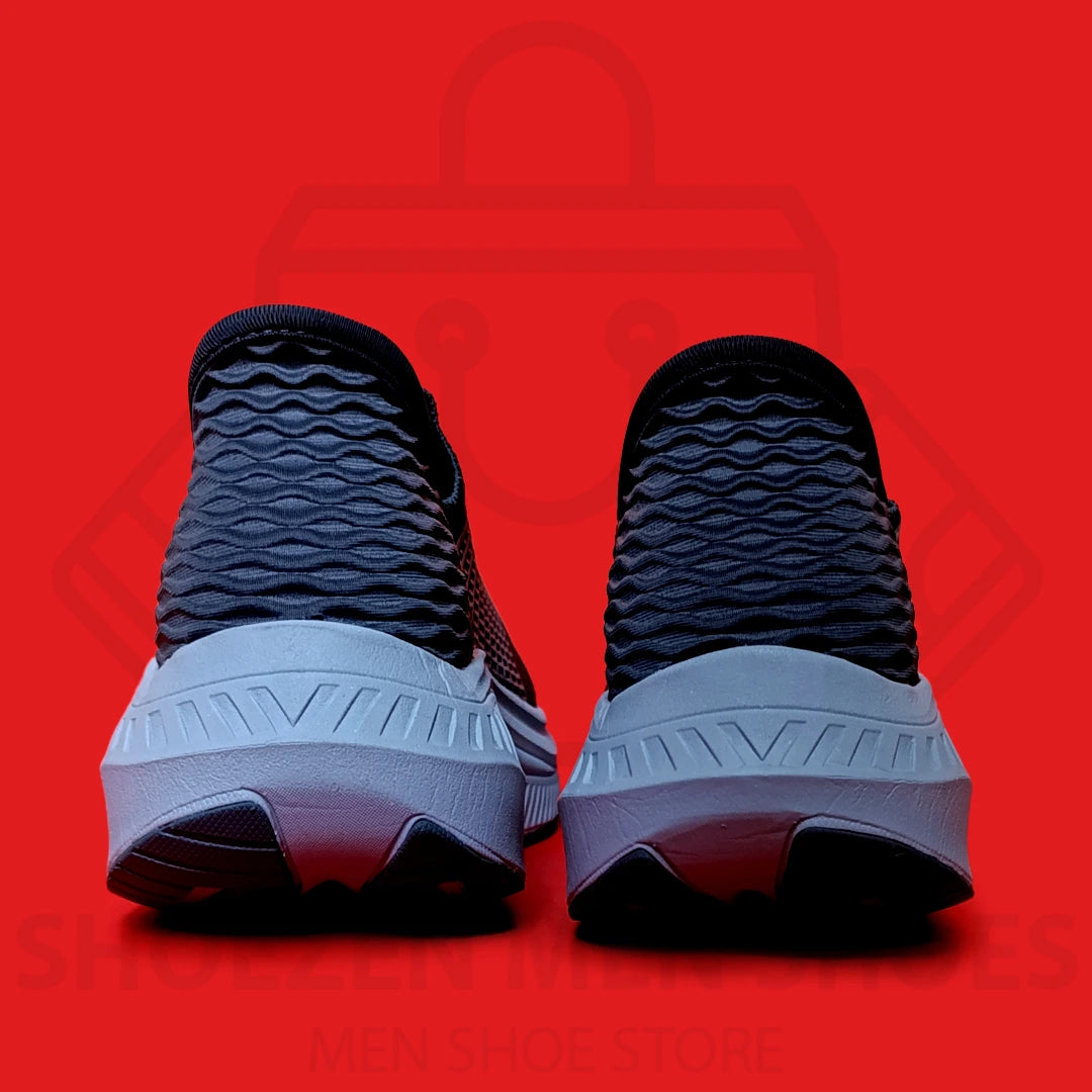 ARCHFIT SLIP-INS SKECHERS  - SHOEZEN MEN SHOES - Navy running shoe with white sole on a red background