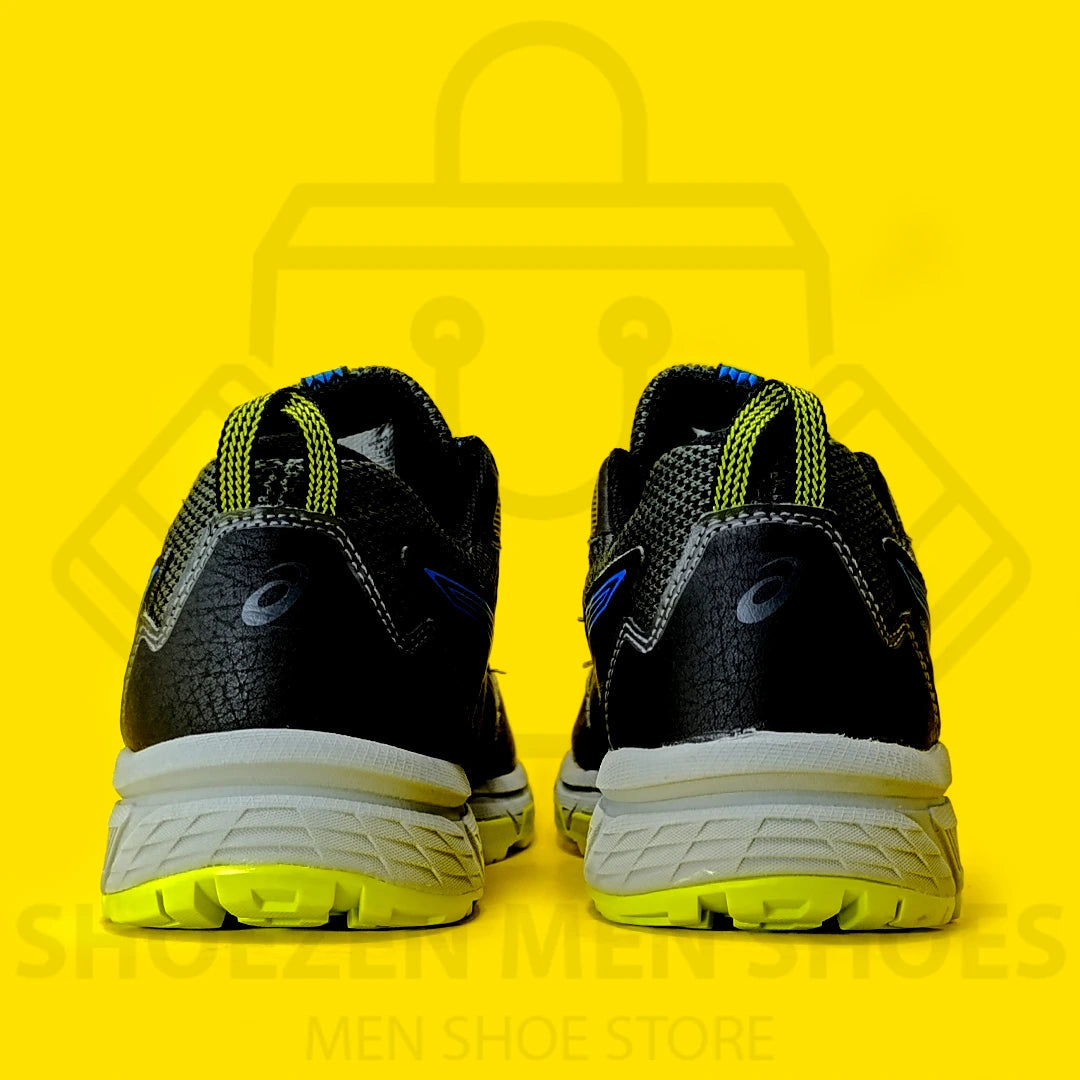 ASCIS GEL-VENTURE 8 Joggers - Shoezen Men Shoes - Black and blue running shoe with yellow sole on a yellow background