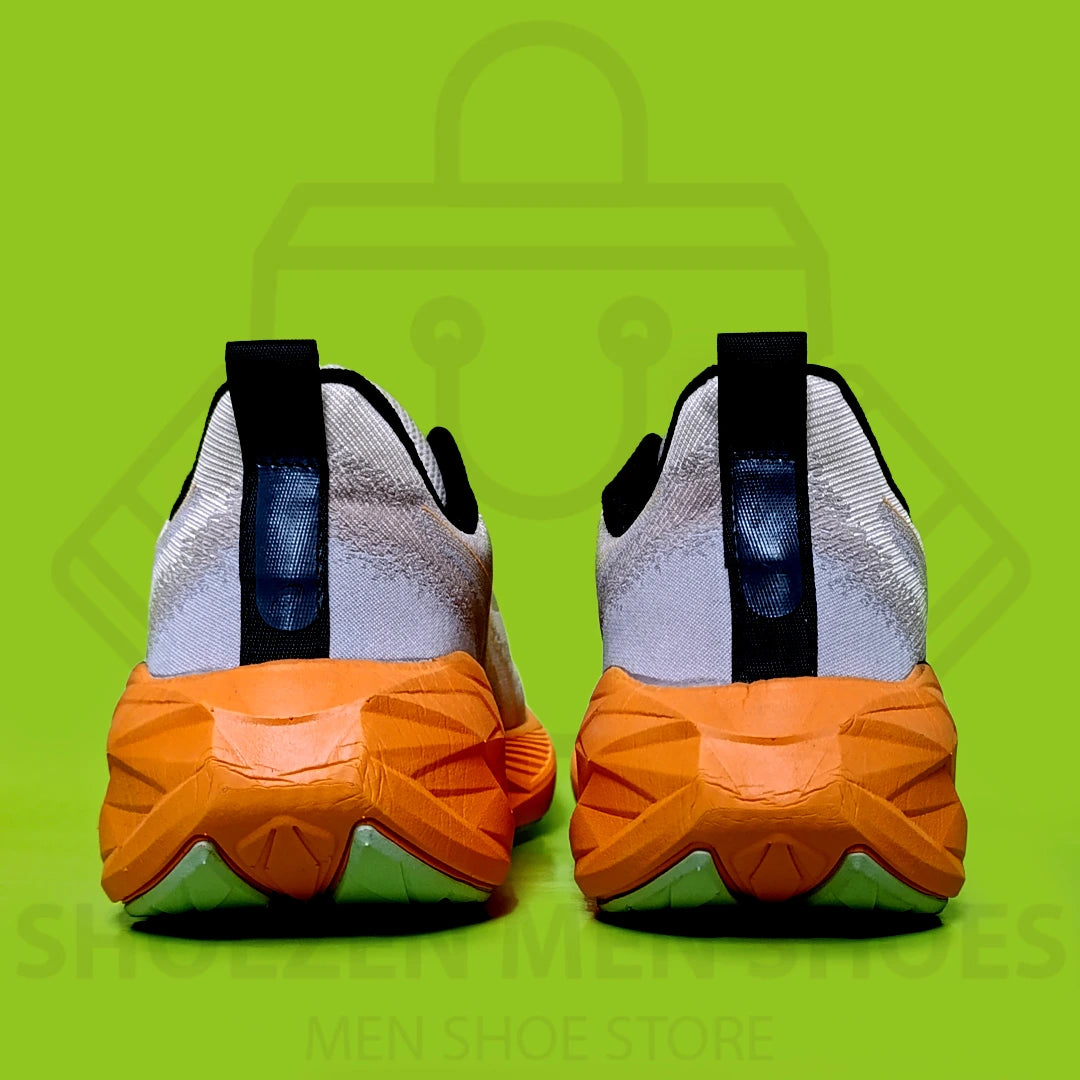 ASCIS NOVABLAST 4 JOGGERS  - SHOEZEN MEN SHOES - White and orange running shoe on a green background with 'Men Shoe Store' text.