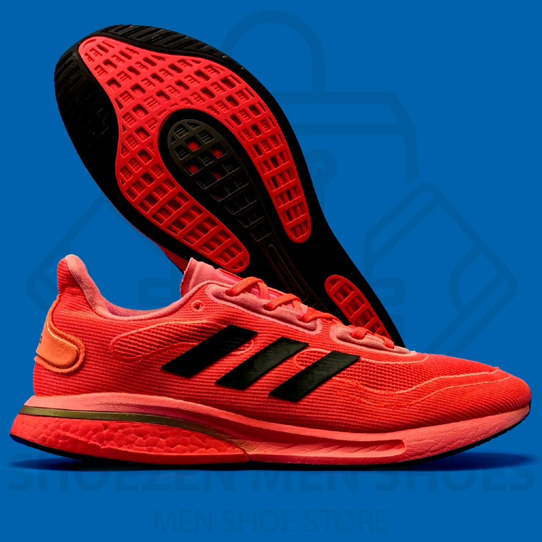 Adi Supernova M 'Red' Joggers - Shoezen Men Shoes - Red running shoe with black accents on a blue background