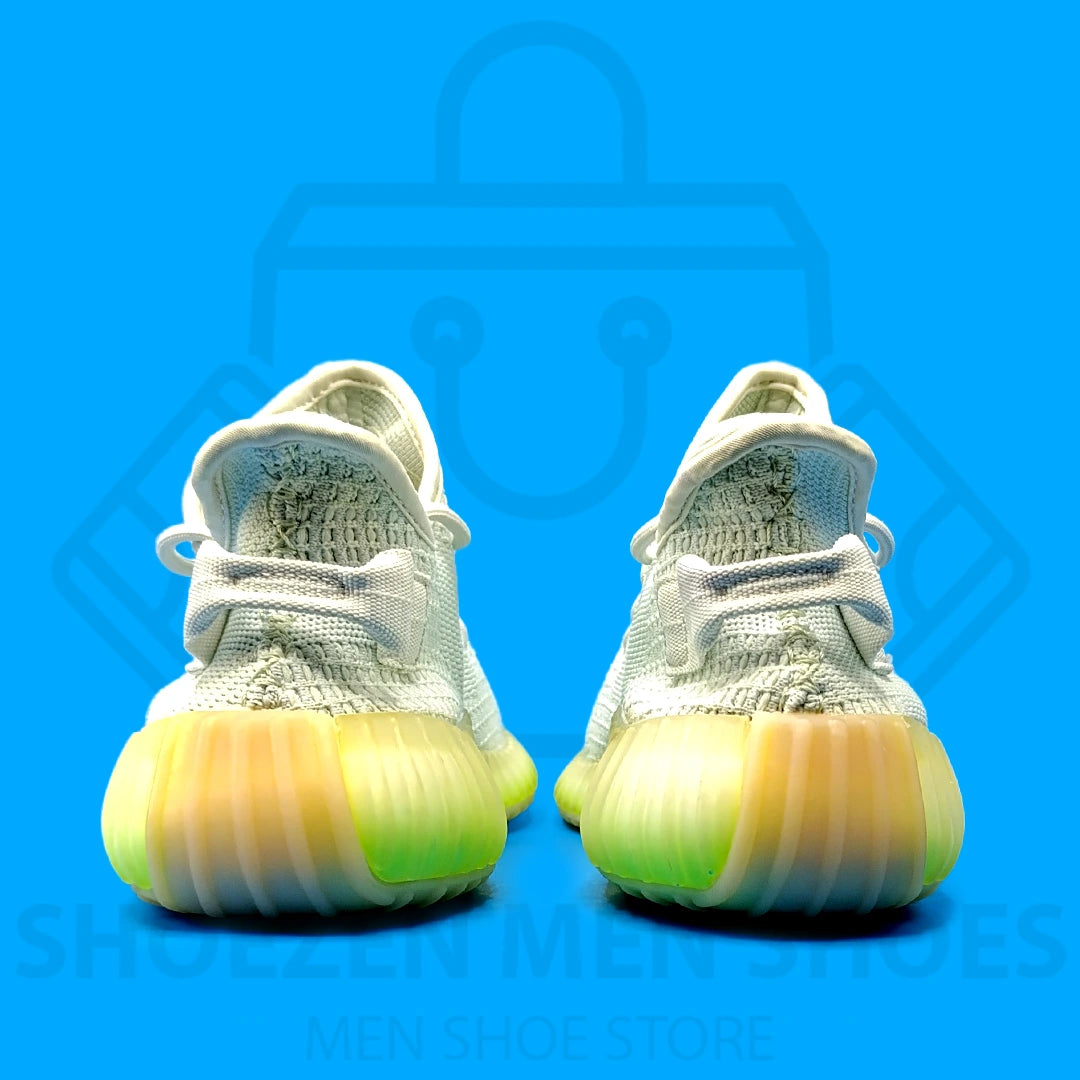 Adi Yeezy Boost 350 V2 Joggers - Shoezen Men Shoes - White and yellow sneaker on a blue background
