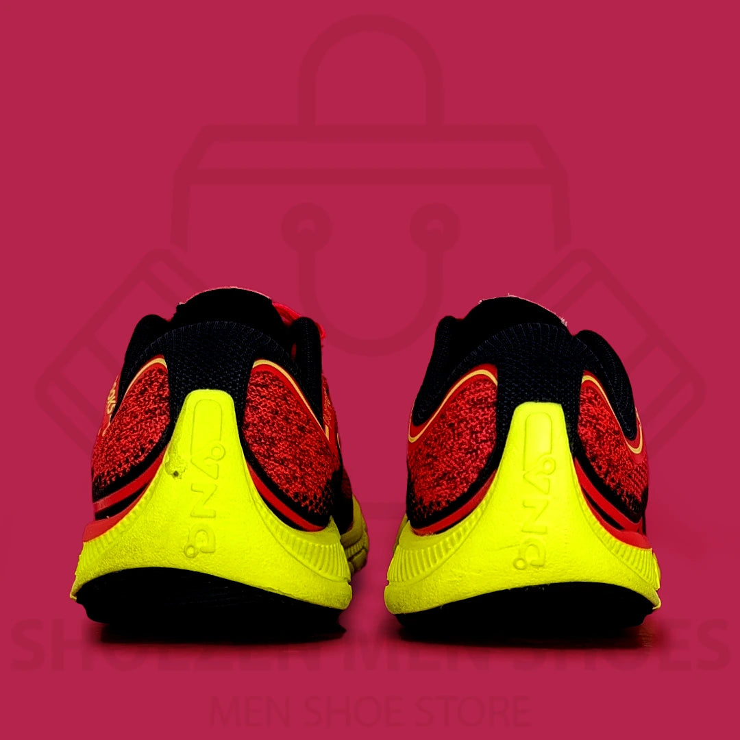 Brooks PureGrit 6 Shoes - Shoezen  Men Shoes - Black, red, and yellow running shoe on a pink background