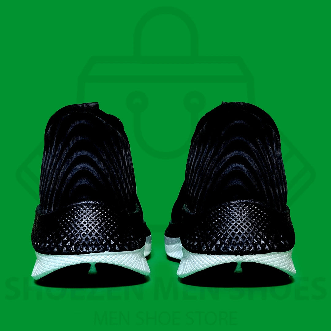 HYPER BURST PRO SLIP-INS SKECHERS - SHOEZEN MEN SHOES - Black running shoe with white sole on a green background