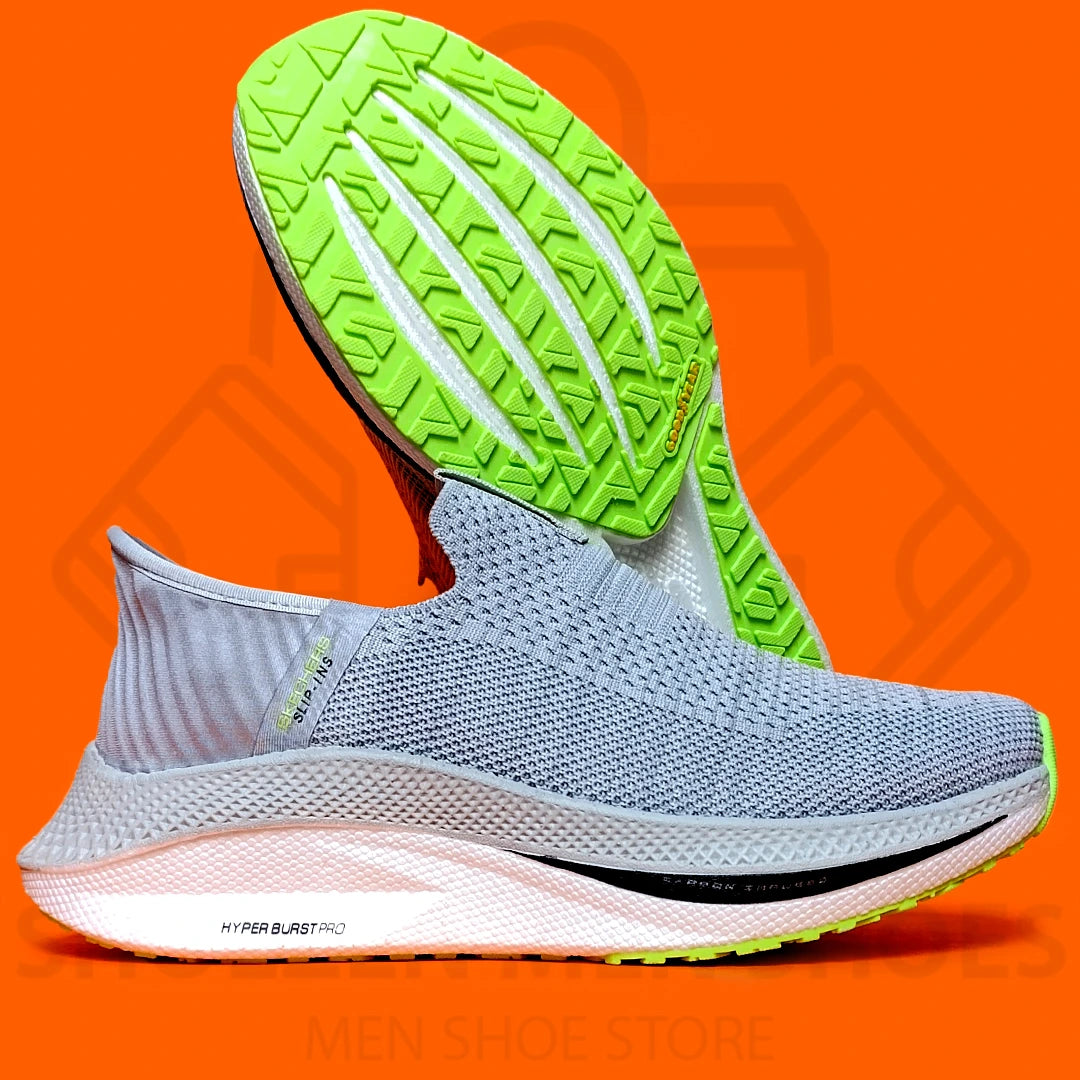 HYPER BURST PRO SLIP-INS SKECHERS - SHOEZEN MEN SHOES - Gray running shoe with green sole on an orange background