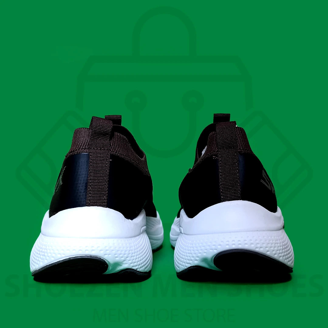 MAX CUSHION SKY SKECHERS - SHOEZEN MEN SHOES - Black and brown running shoe with white sole on a green background