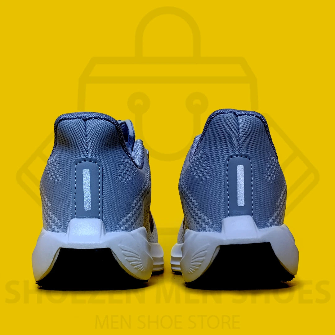 NK PEGASUS TURBO JOGGERS - SHOEZEN MEN SHOES - Gray running shoe with black Nike logo on a yellow background