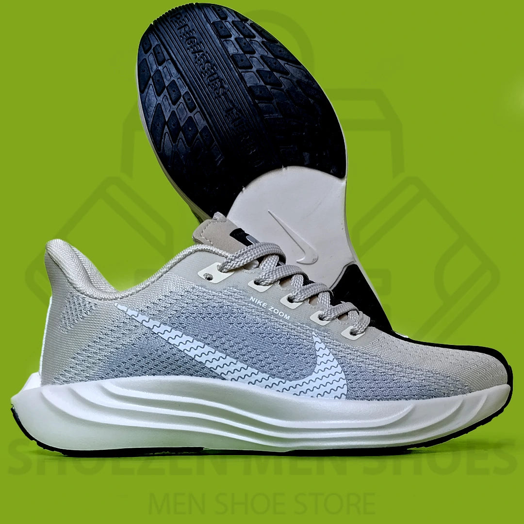 NK PEGASUS TURBO JOGGERS - SHOEZEN MEN SHOES - Gray running shoe with black sole on a green background