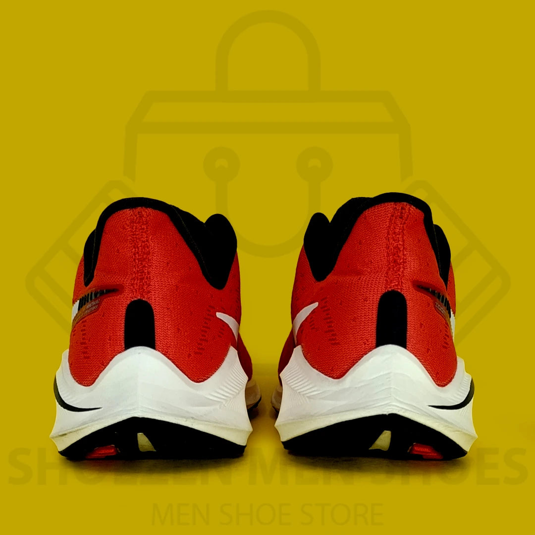 Nike Air Zoom Vomero 14 Joggers - Shoezen Men Shoes - Red and black running shoe with a white swoosh logo on a yellow background
