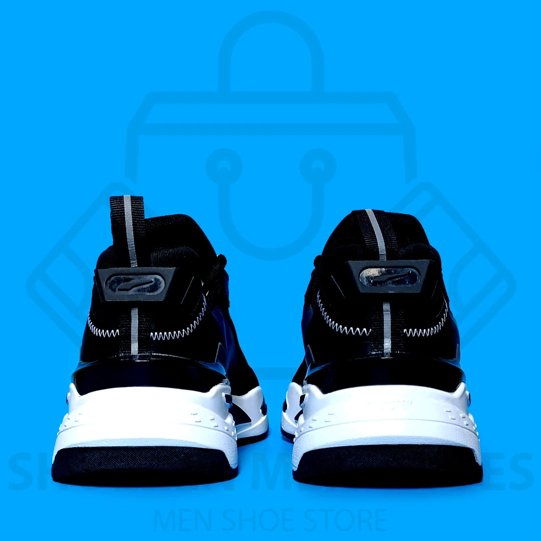 PUMA RS JOGGERS  - SHOEZEN MEN SHOES - Black and white sneaker with Puma logo on a blue background