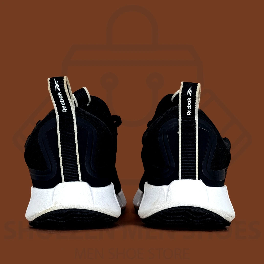 Rebk Zig Sky Training Shoes - Shoezen Men Shoes - Black running shoe with white sole on a brown background