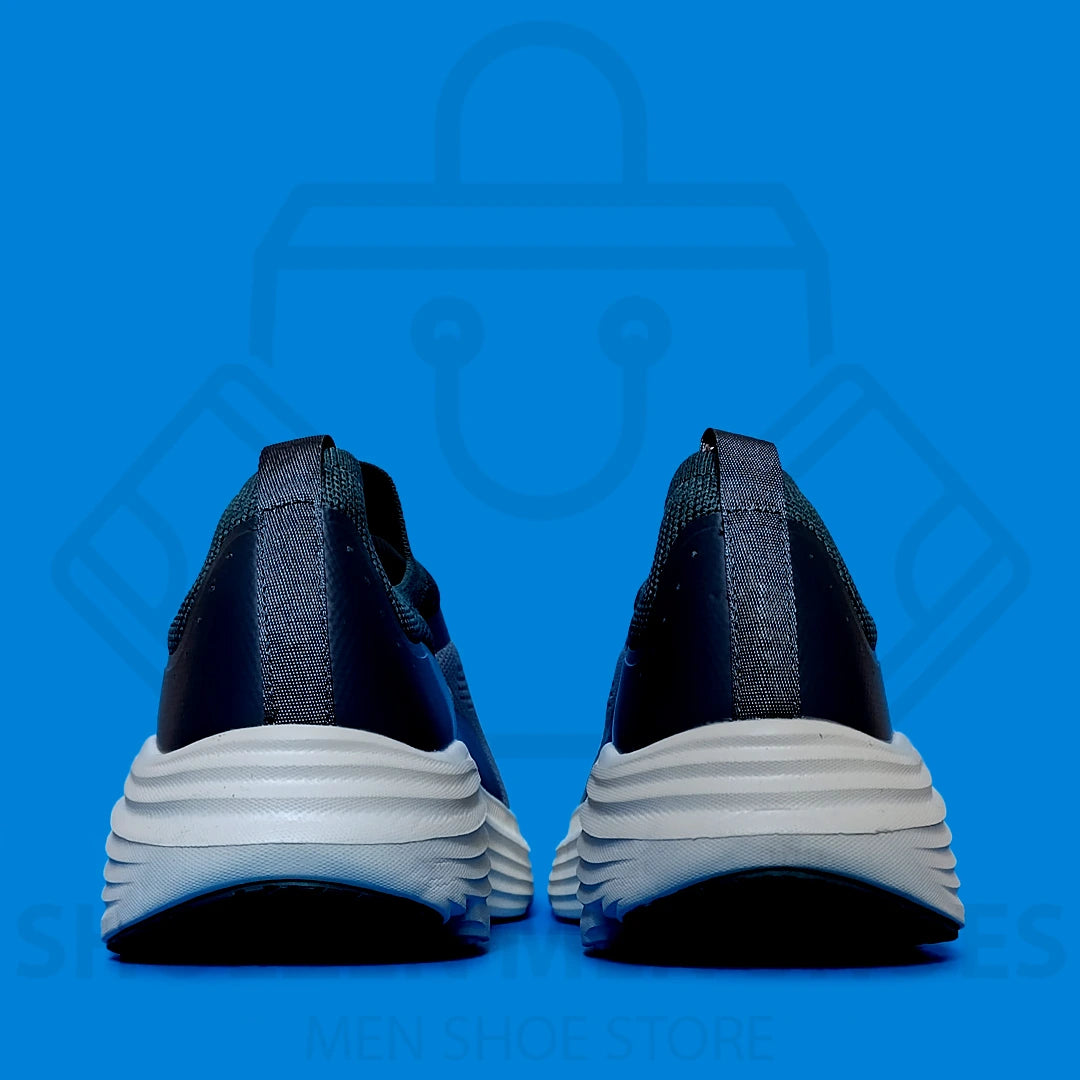 TRENDY MAX CUSHION SKECHERS - SHOEZEN MEN SHOES - Blue running shoe with white sole on a blue background