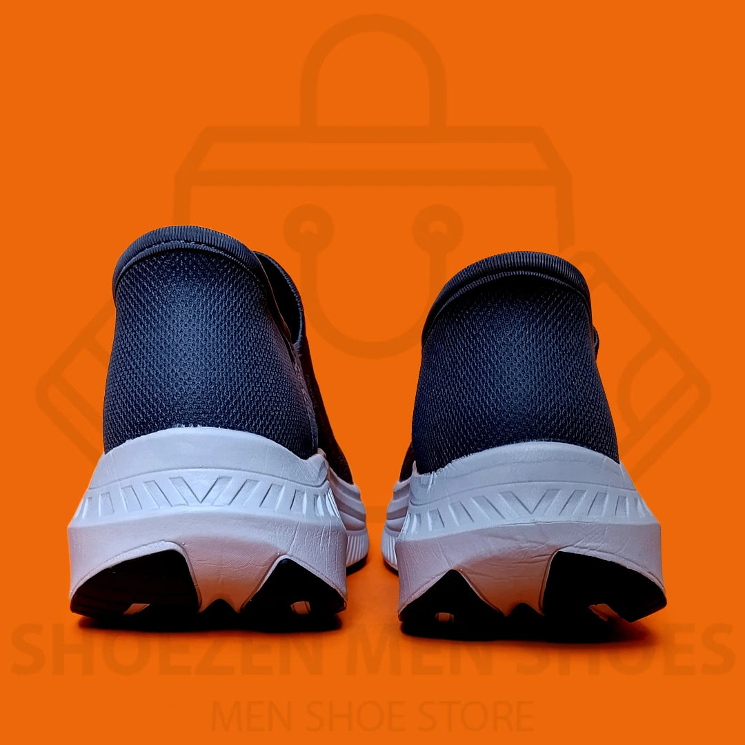 TRENDY SLIP-INS SKECHERS - SHOEZEN MEN SHOES - Navy running shoe with white sole on an orange background